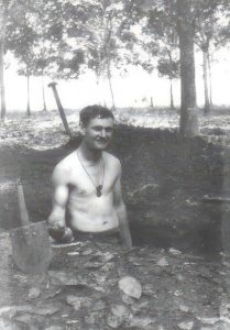 21 year old Private Dennis .J. McCormack digging a weapons pit at Nui Dat, South Vietnam.